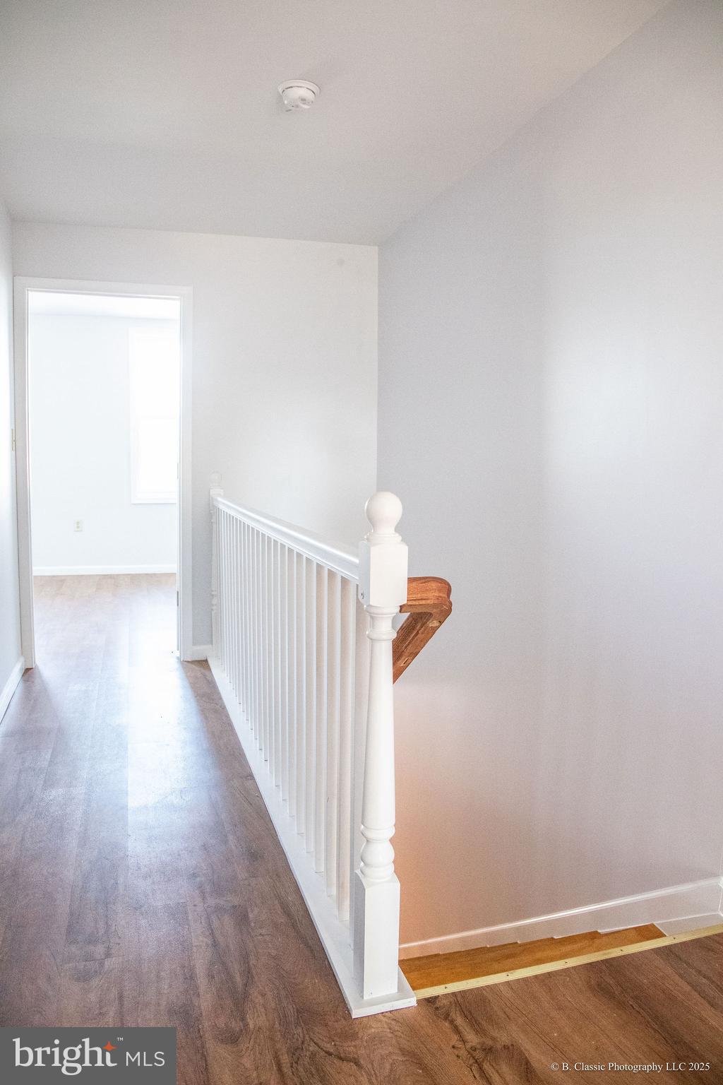 3035 West Belvedere Avenue Baltimore, MD 21215 - Photo 35 of 49 a view of a hallway with wooden floor
