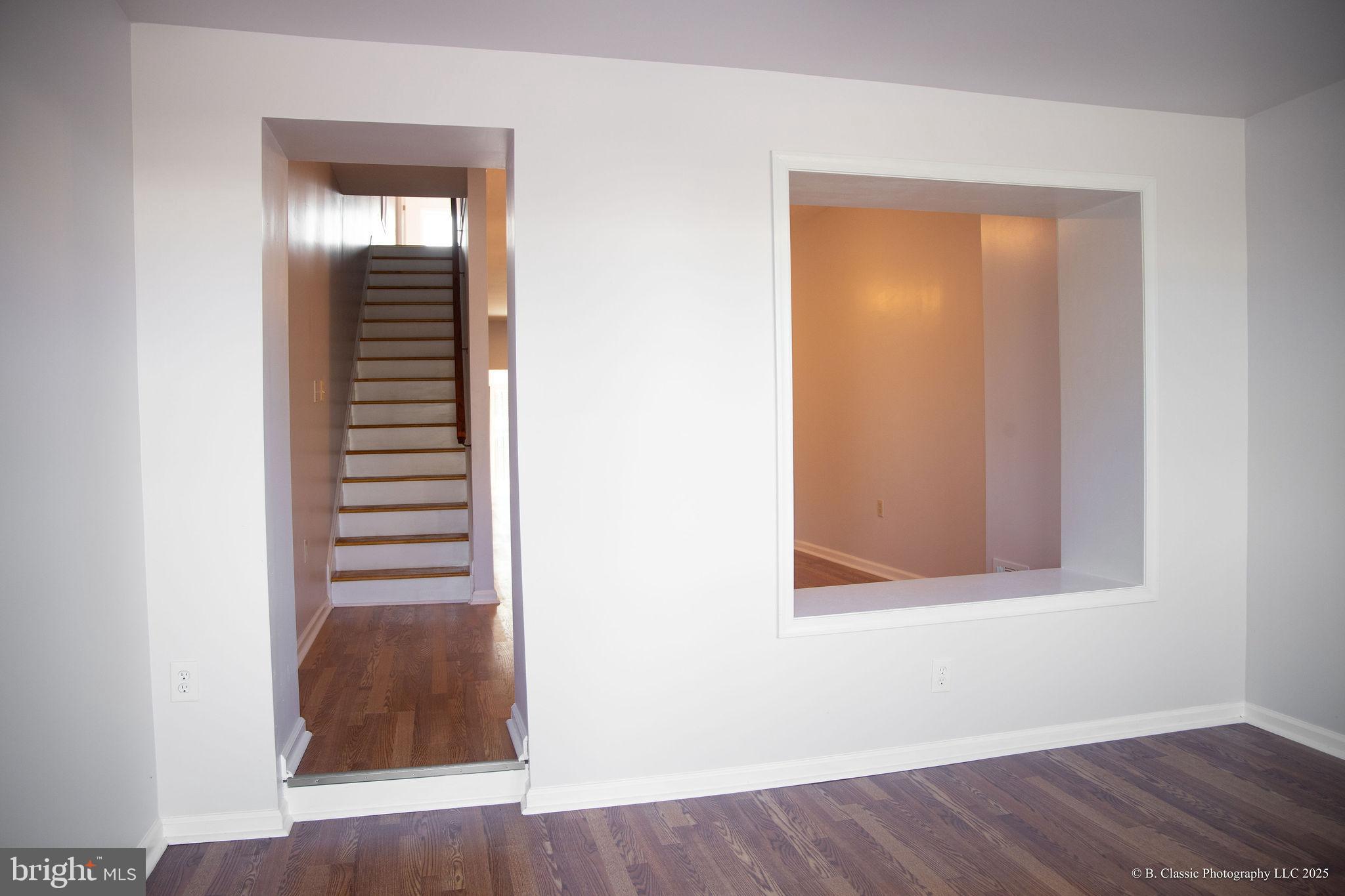 3035 West Belvedere Avenue Baltimore, MD 21215 - Photo 4 of 49 a view of a hallway with wooden floor