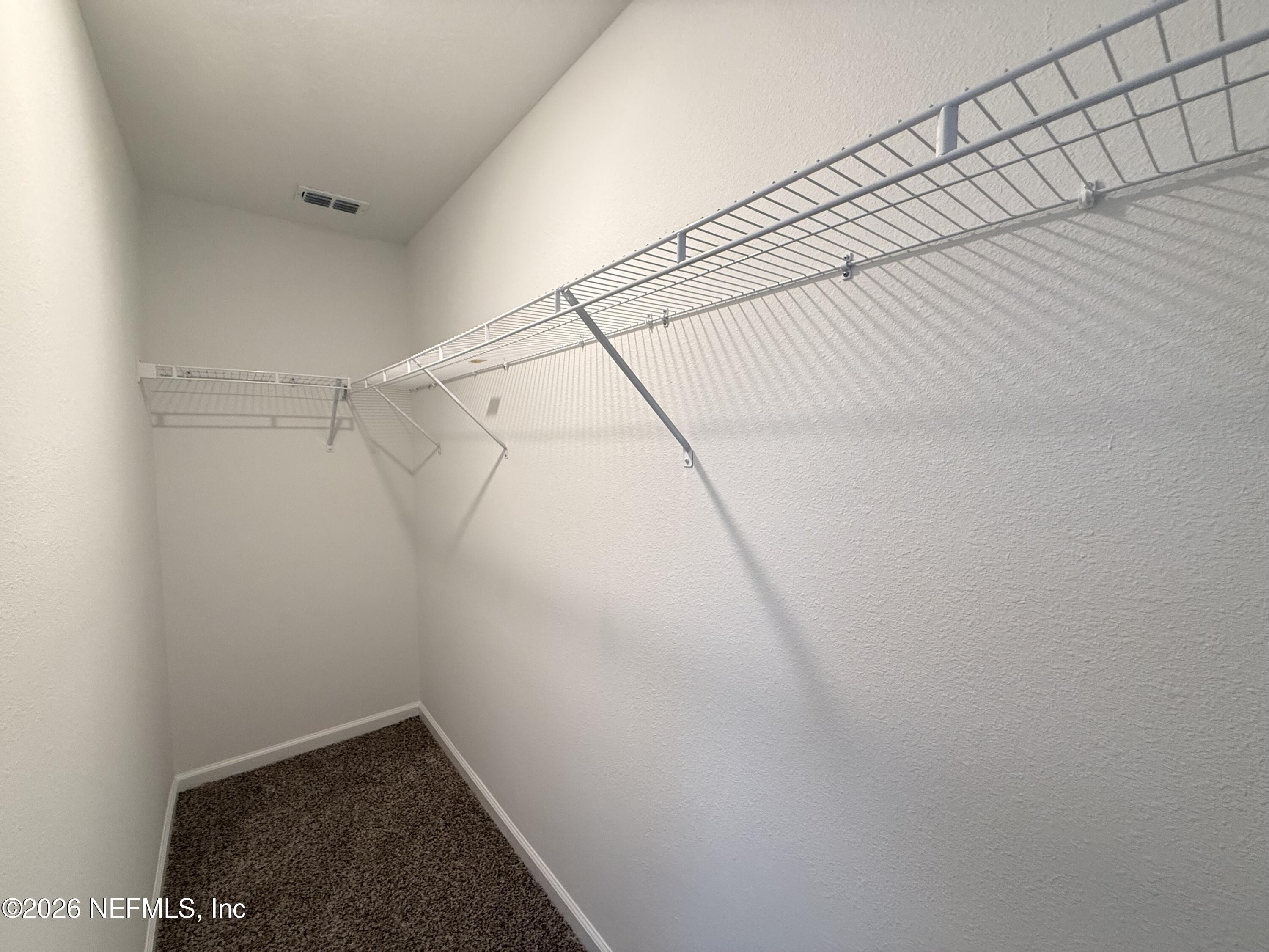 88 Crisanto Road St. Augustine, FL 32084 - Photo 12 of 21 a view of a room with racks on the wall