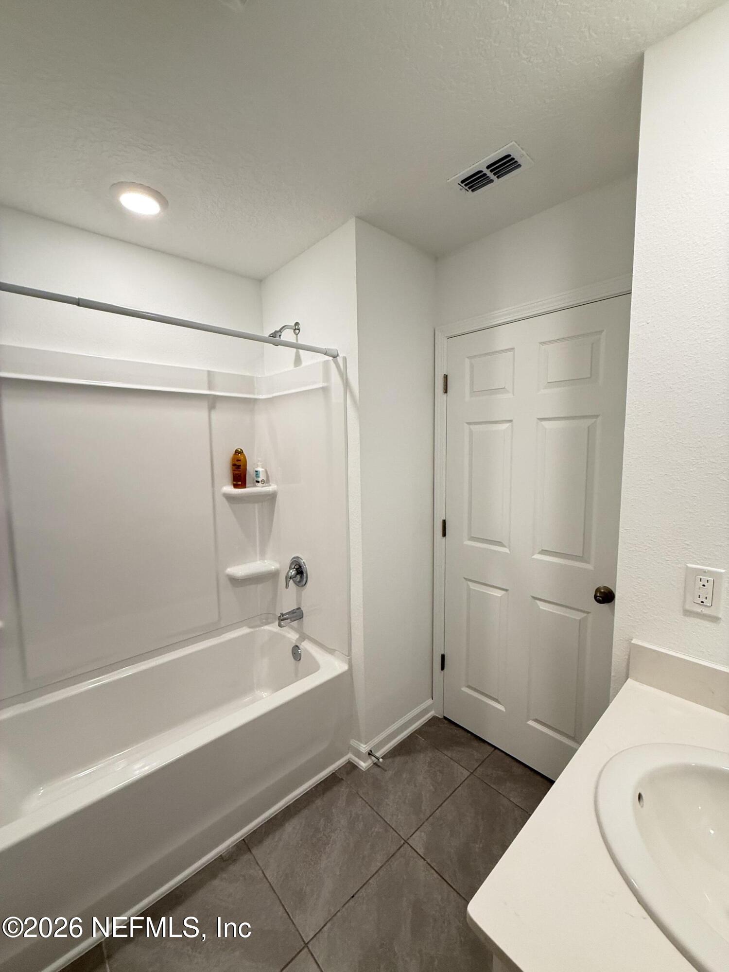 88 Crisanto Road St. Augustine, FL 32084 - Photo 20 of 21 a bathroom with a sink and a bathtub