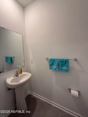 a view of a hallway with closet and bathroom