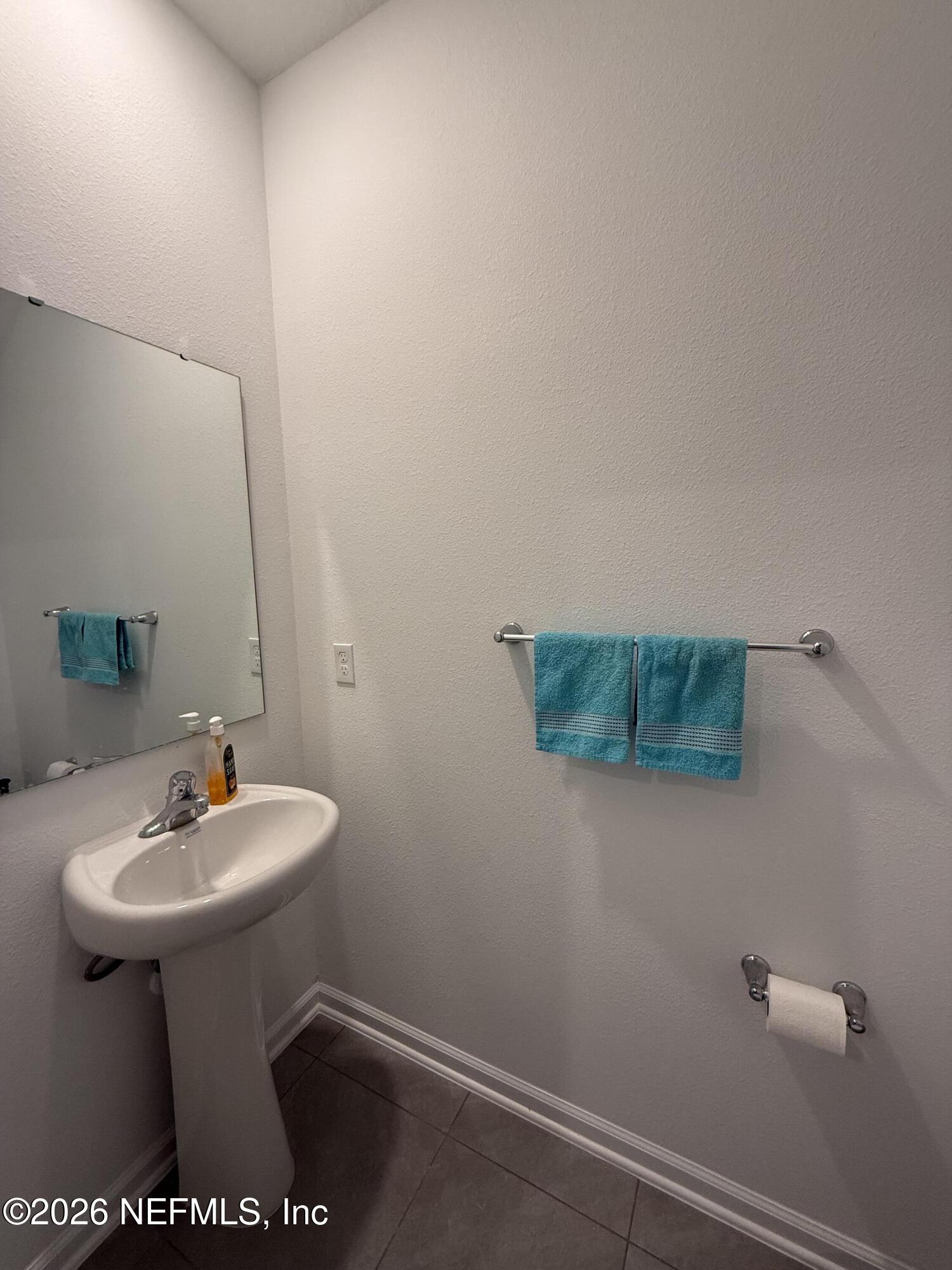 88 Crisanto Road St. Augustine, FL 32084 - Photo 7 of 21 a bathroom with a sink toilet and mirror