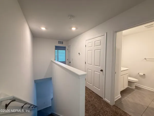 a view of a room with racks on the wall