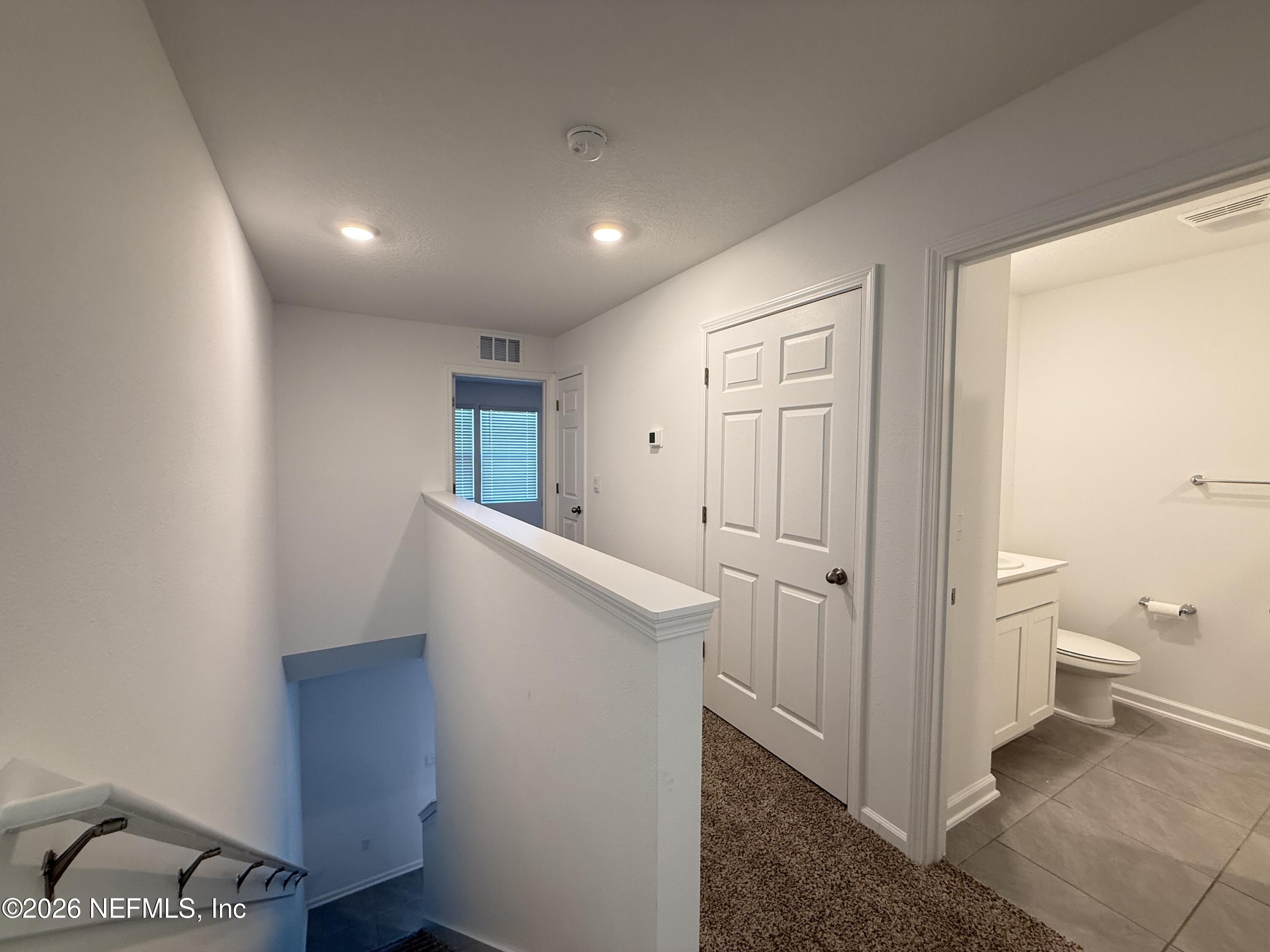88 Crisanto Road St. Augustine, FL 32084 - Photo 9 of 21 a view of a hallway with closet and bathroom