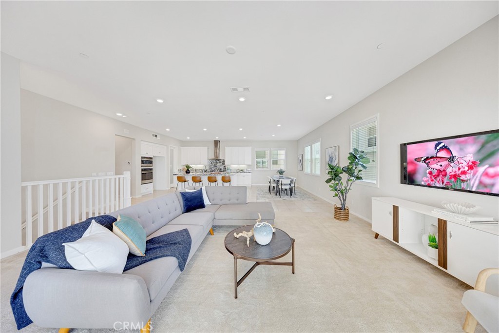 104 Sculpture Irvine, CA 92618 - Photo 1 of 36 a living room with furniture and a flat screen tv