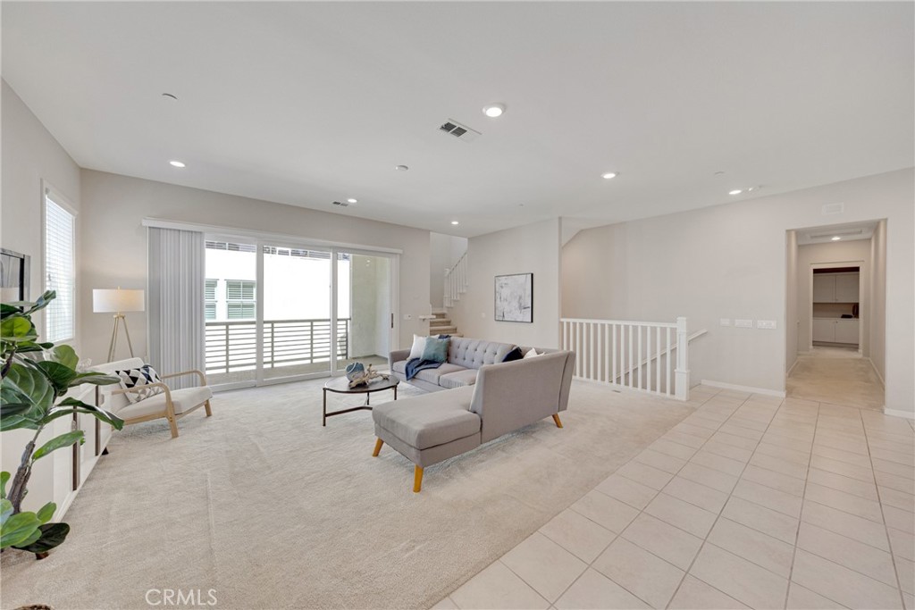 104 Sculpture Irvine, CA 92618 - Photo 11 of 36 a living room with furniture and large windows