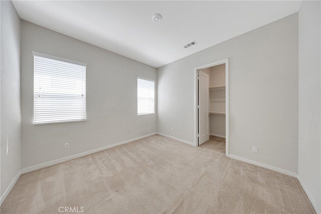 104 Sculpture Irvine, CA 92618 - Photo 16 of 36 an empty room with windows