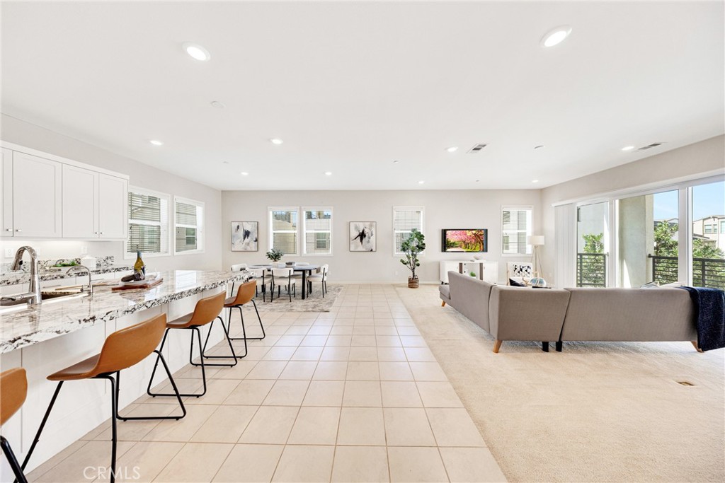 104 Sculpture Irvine, CA 92618 - Photo 2 of 36 a living room with furniture and a flat screen tv