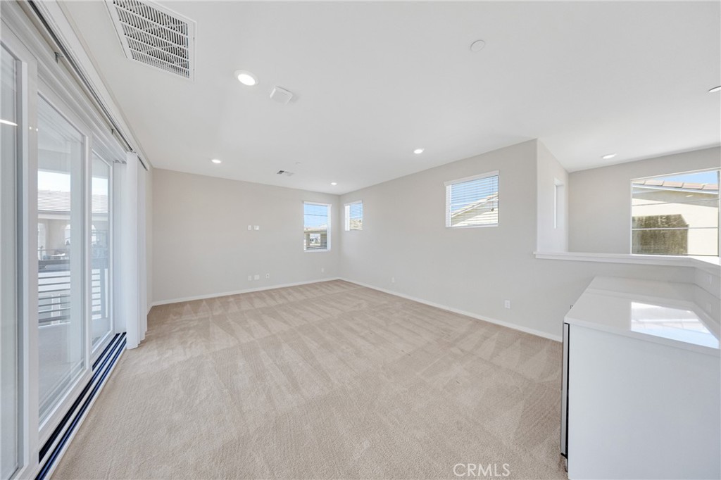 104 Sculpture Irvine, CA 92618 - Photo 23 of 36 a view of an empty room with a window
