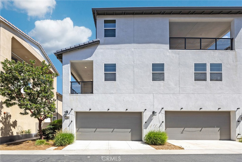 104 Sculpture Irvine, CA 92618 - Photo 28 of 36 a front view of a house with garage