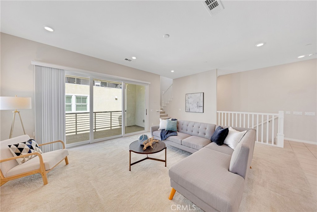 104 Sculpture Irvine, CA 92618 - Photo 7 of 36 a living room with furniture and a window