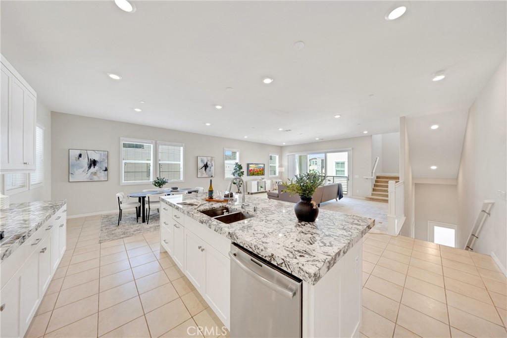 104 Sculpture Irvine, CA 92618 - Photo 10 of 36 a kitchen with stainless steel appliances granite countertop a sink and cabinets