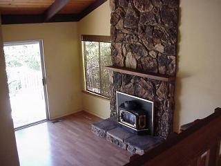 7860 Barcaglia Road Sebastopol, CA 95472 - Photo 4 of 8 a room with a fireplace and a floor to ceiling window
