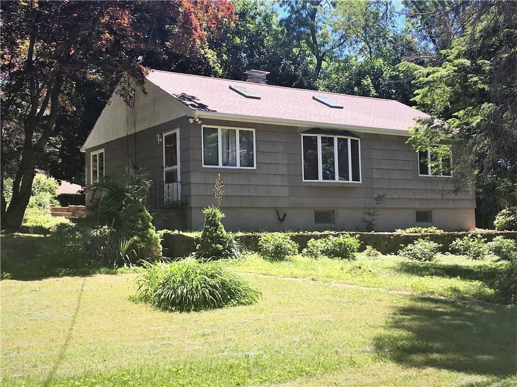 21 Candle Hill Road New Fairfield, CT 06812 - Photo 1 of 1 a front view of a house with a yard