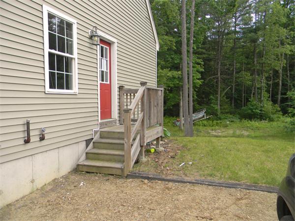 88 Eagleville Road Orange, MA 01364 - Photo 3 of 14 a view of a house with backyard and trees