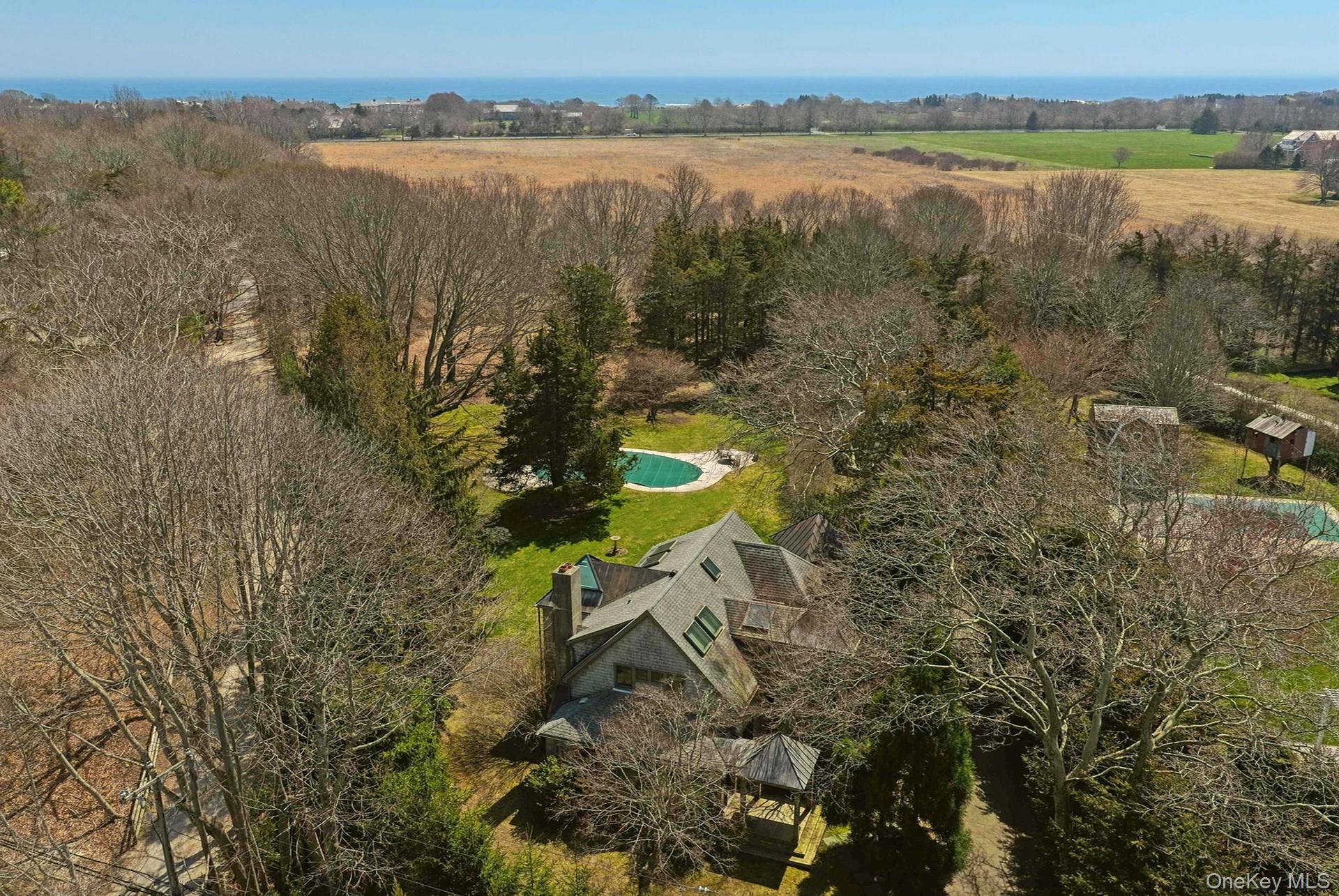 a aerial view of a house with a lake view