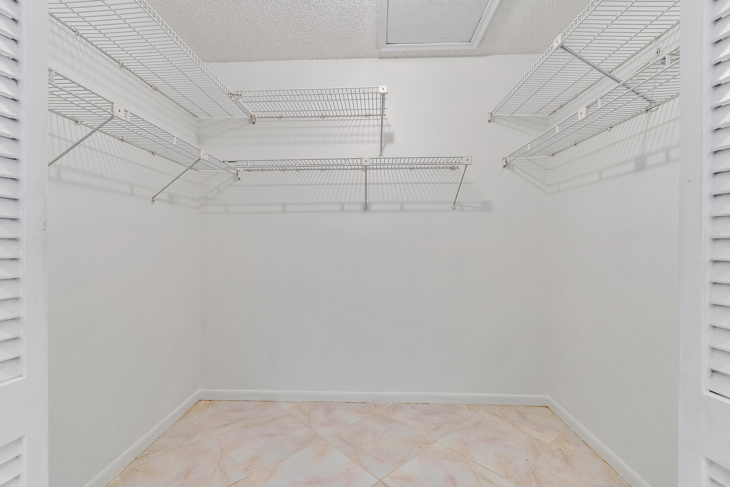 7938 Cloverfield Circle Boca Raton, FL 33433 - Photo 16 of 27 a view of a room with racks on the wall