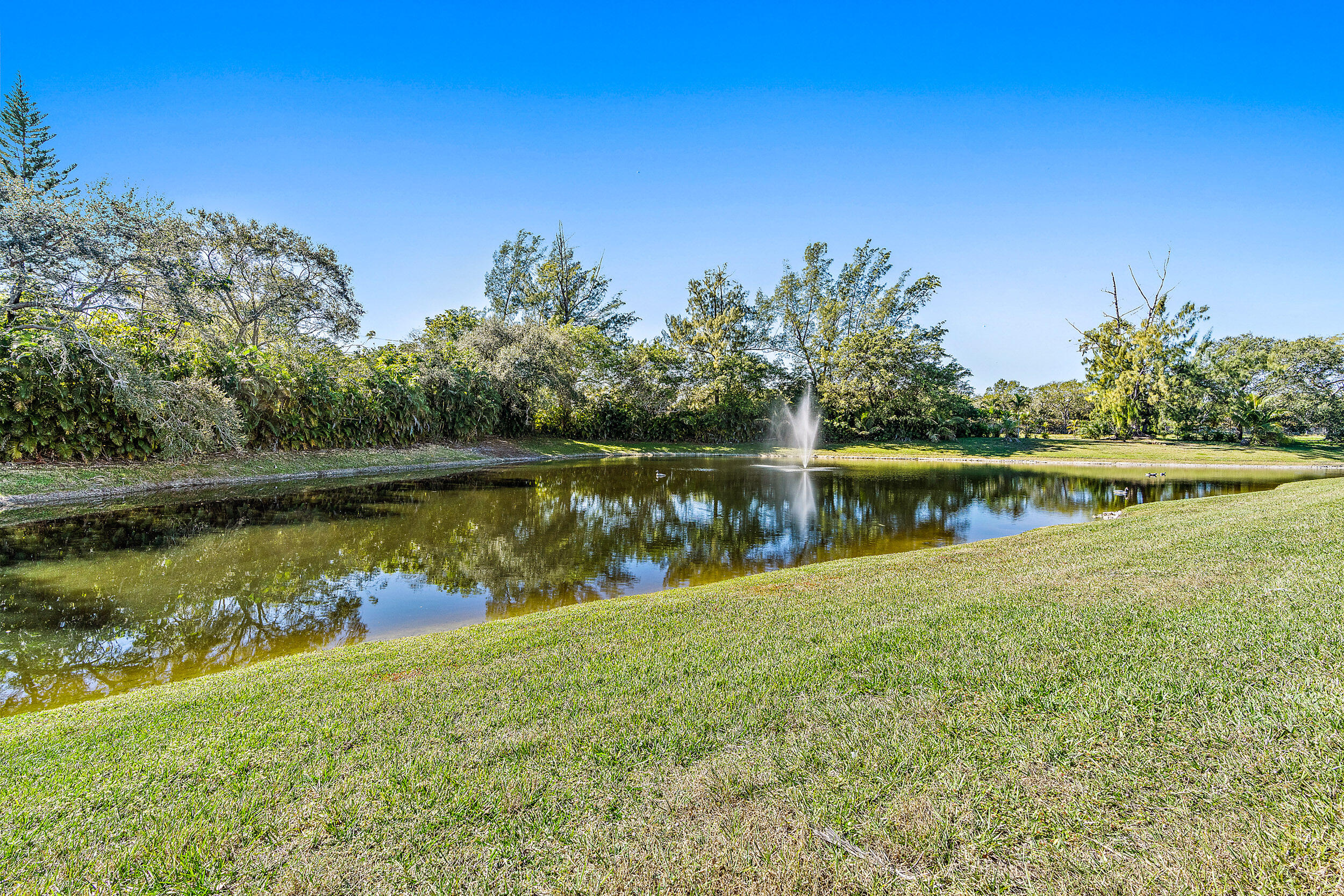 7938 Cloverfield Circle Boca Raton, FL 33433 - Photo 20 of 27 a view of a lake with a lake in the background