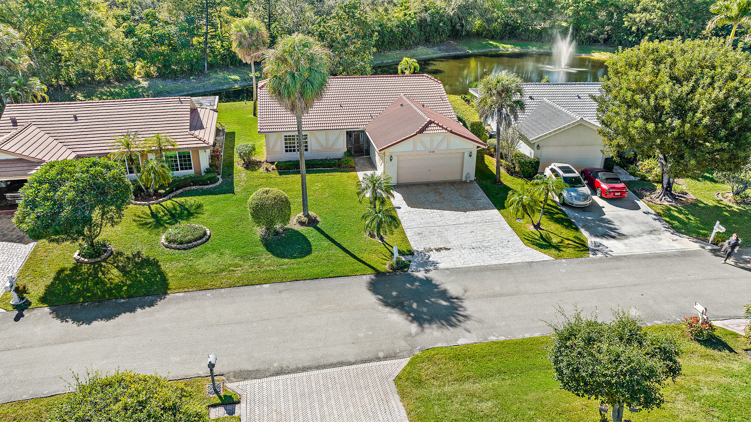 7938 Cloverfield Circle Boca Raton, FL 33433 - Photo 21 of 27 an aerial view of a house with a yard and a bench
