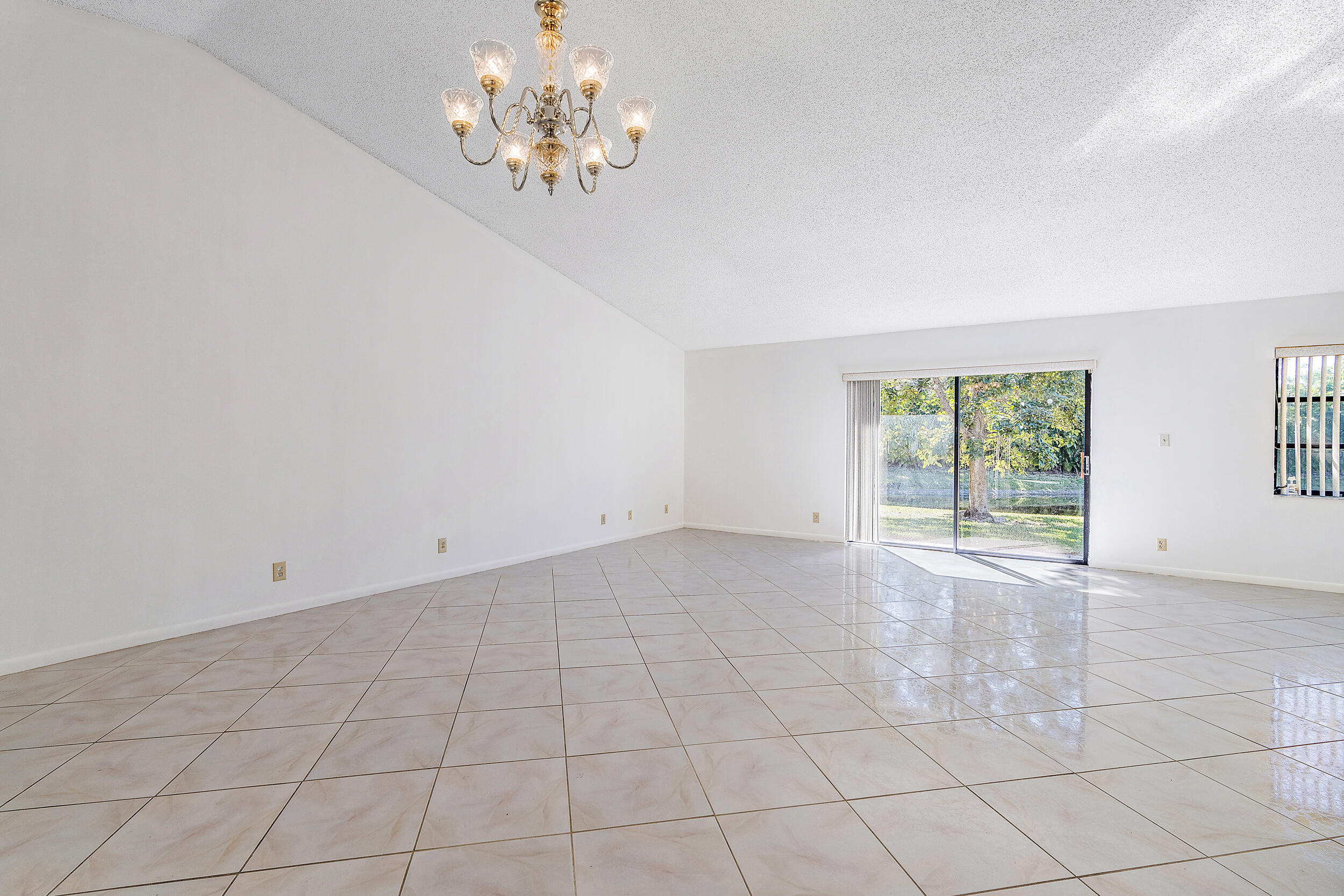 7938 Cloverfield Circle Boca Raton, FL 33433 - Photo 5 of 27 a view of an empty room with a window