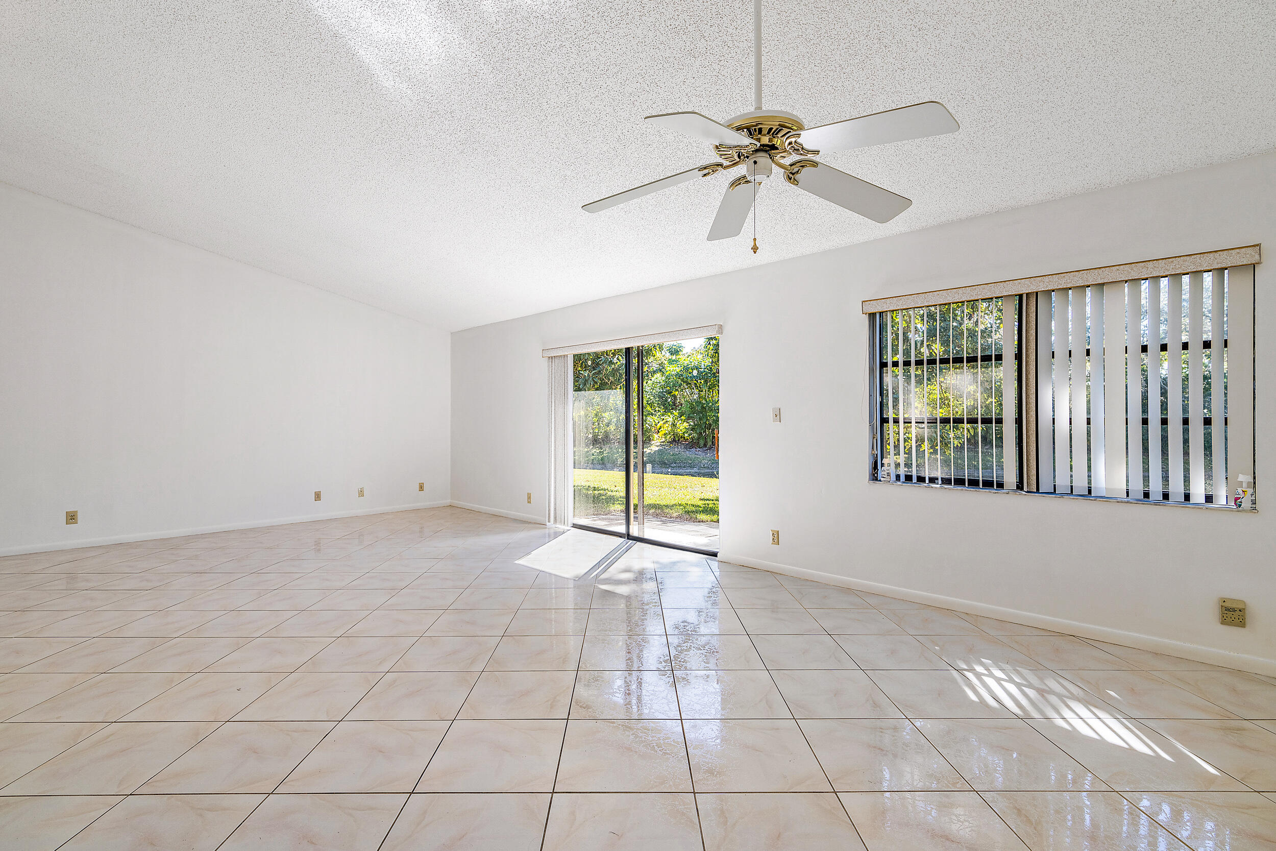 7938 Cloverfield Circle Boca Raton, FL 33433 - Photo 7 of 27 a view of an empty room with a window