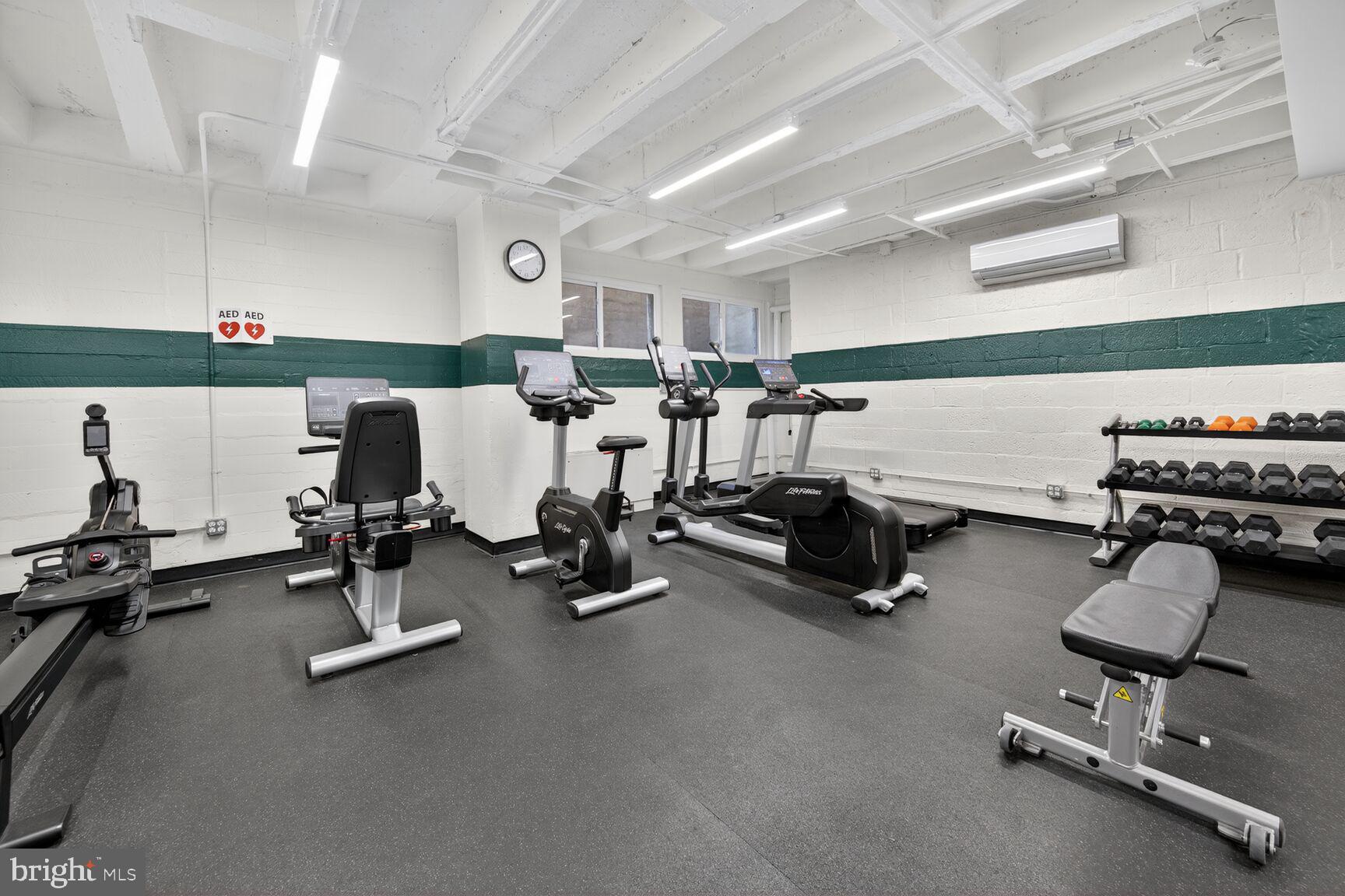 4301 Massachusetts Avenue Northwest, Unit 5009 Washington, DC 20016 - Photo 12 of 14 a room with gym equipment and a table