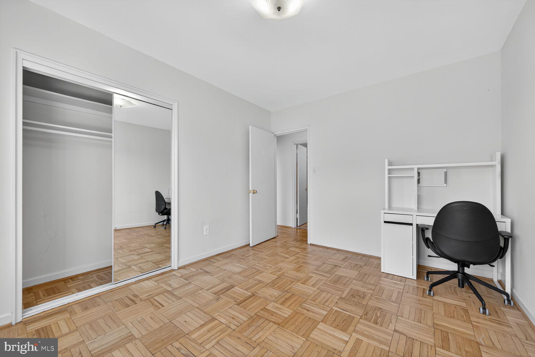 4301 Massachusetts Avenue Northwest, Unit 5009 Washington, DC 20016 - Photo 6 of 14 a room with a chair and a floor to ceiling window