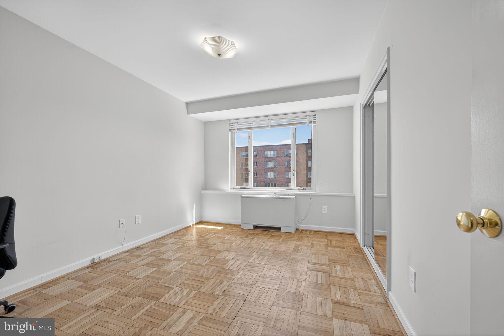 4301 Massachusetts Avenue Northwest, Unit 5009 Washington, DC 20016 - Photo 7 of 14 a view of an empty room with a window