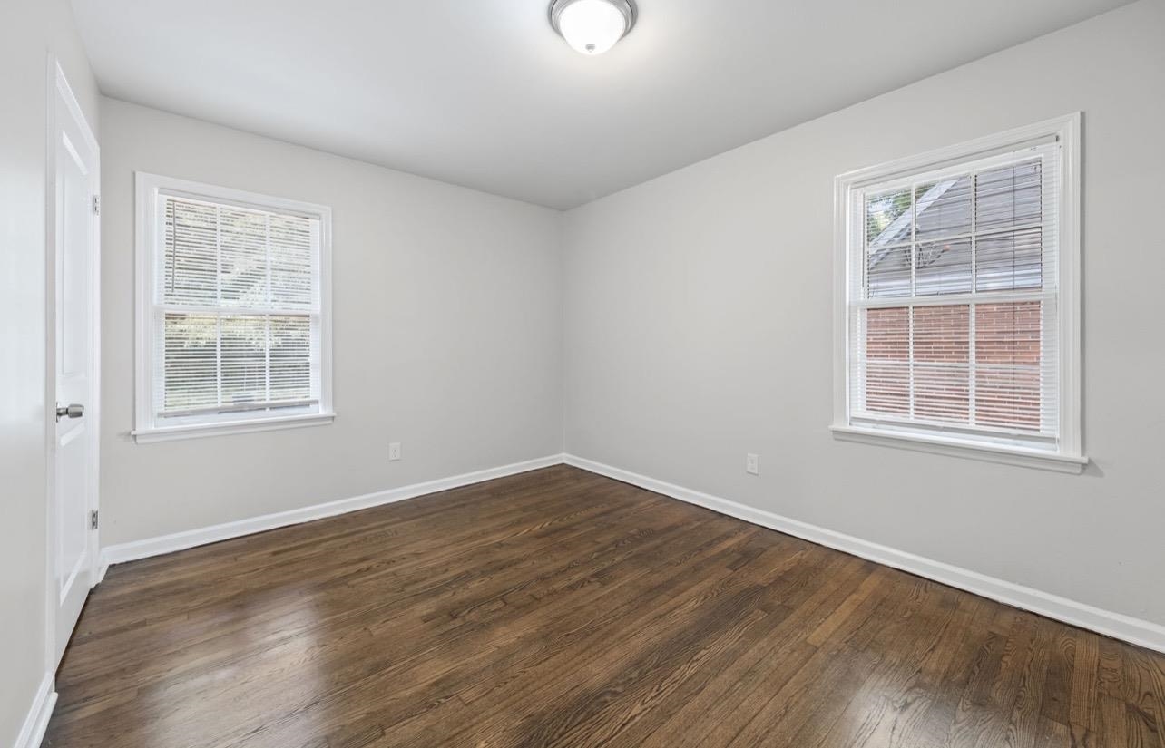 3843 Blue Jay Road Memphis, TN 38116 - Photo 15 of 23 Spare room with dark wood-style flooring
