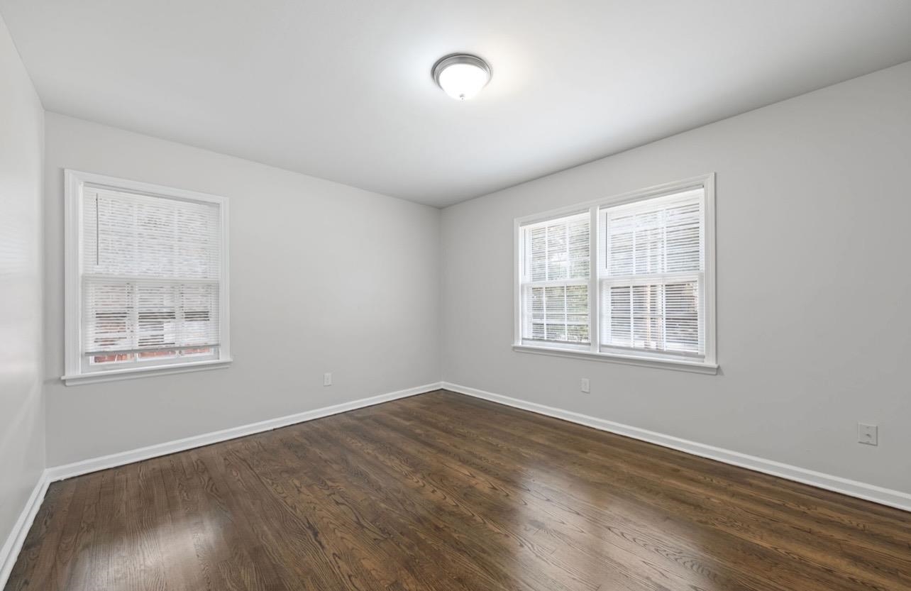 3843 Blue Jay Road Memphis, TN 38116 - Photo 16 of 23 Empty room with dark wood finished floors and baseboards