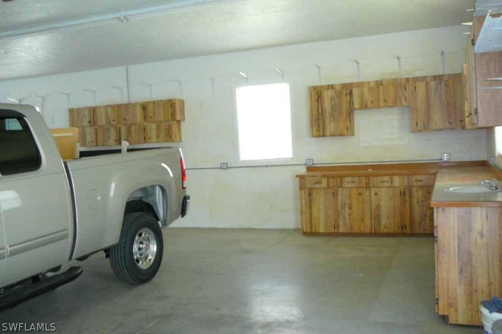 8221 Matanzas Road Fort Myers, FL 33967 - Photo 17 of 24 a utility room with dryer and washer