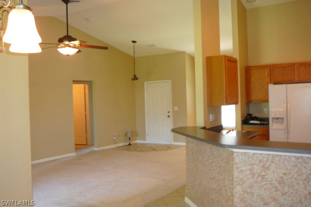 8221 Matanzas Road Fort Myers, FL 33967 - Photo 3 of 24 a view of a kitchen with a sink and refrigerator