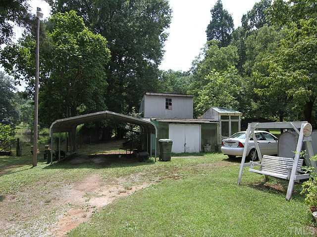 2135 Winkler Road Durham, NC 27712 - Photo 12 of 13 a view of a chair and table in backyard