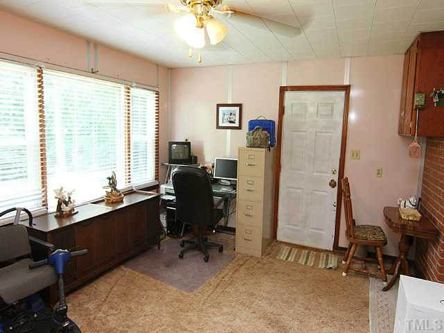 2135 Winkler Road Durham, NC 27712 - Photo 7 of 13 a view of a workspace with furniture and a window