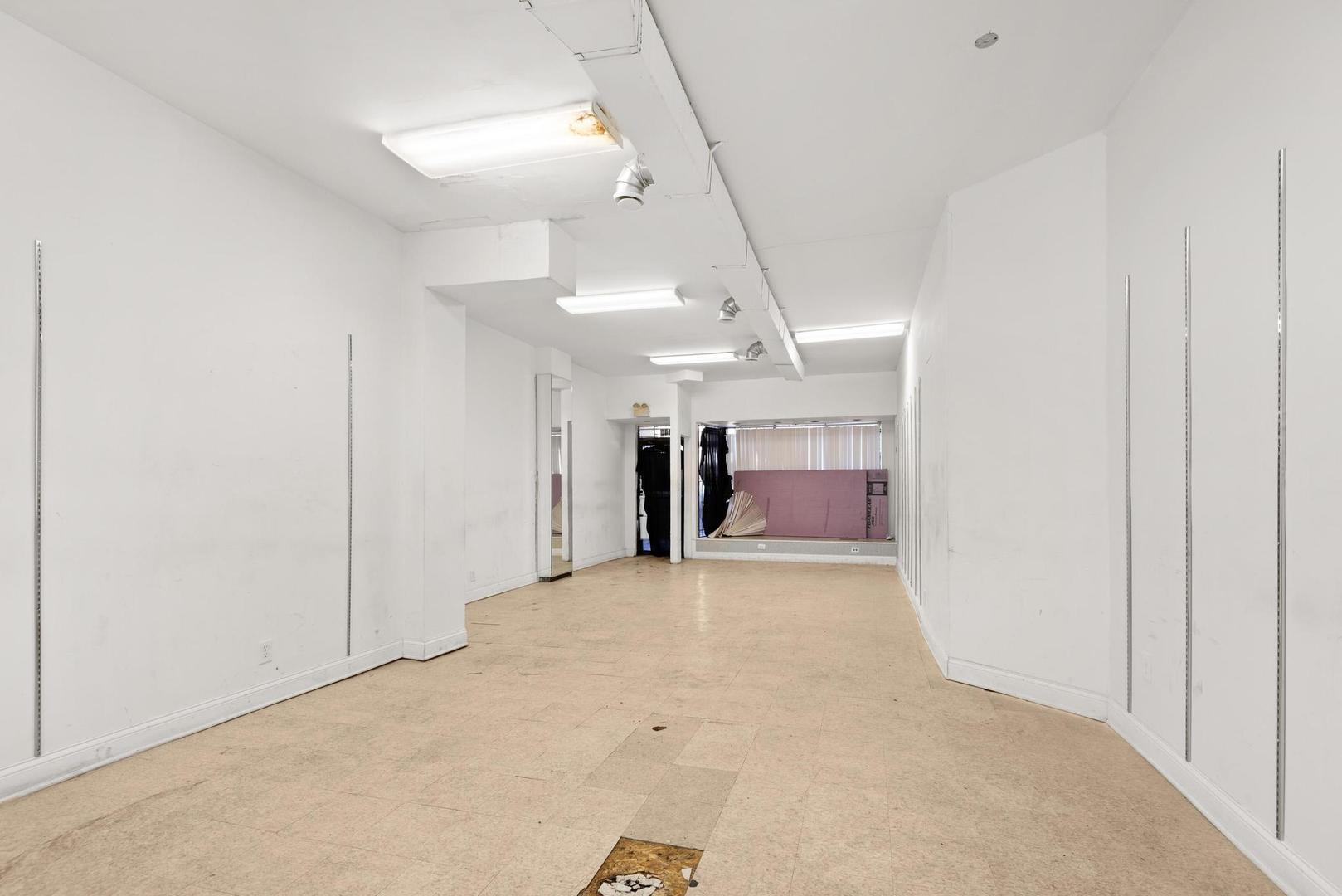 5941 West Chicago Avenue Chicago, IL 60651 - Photo 2 of 13 a view of a hallway with room and a window