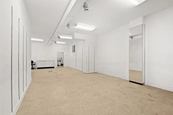 an empty room with a bathroom