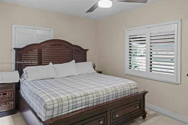 a bedroom with a bed and dresser