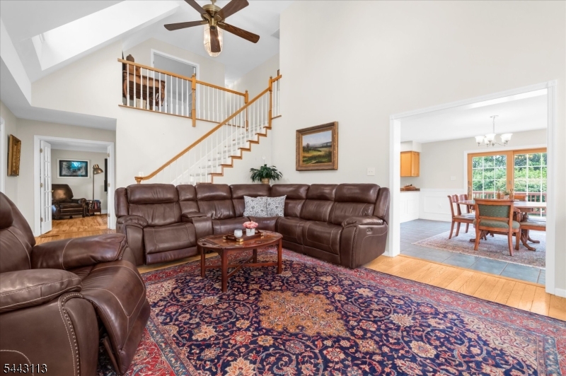54 Rick Road Milford, NJ 08848 - Photo 5 of 50 a living room with furniture and a dining table with wooden floor