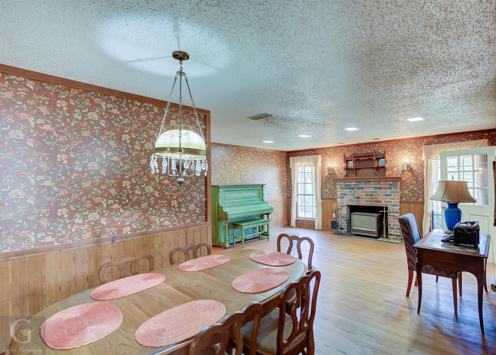 7105 Rodessa Ida Road Ida, LA 71044 - Photo 14 of 40 a view of a dining room with furniture window and wooden floor