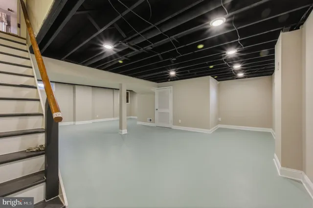 a view of an empty room with stairs