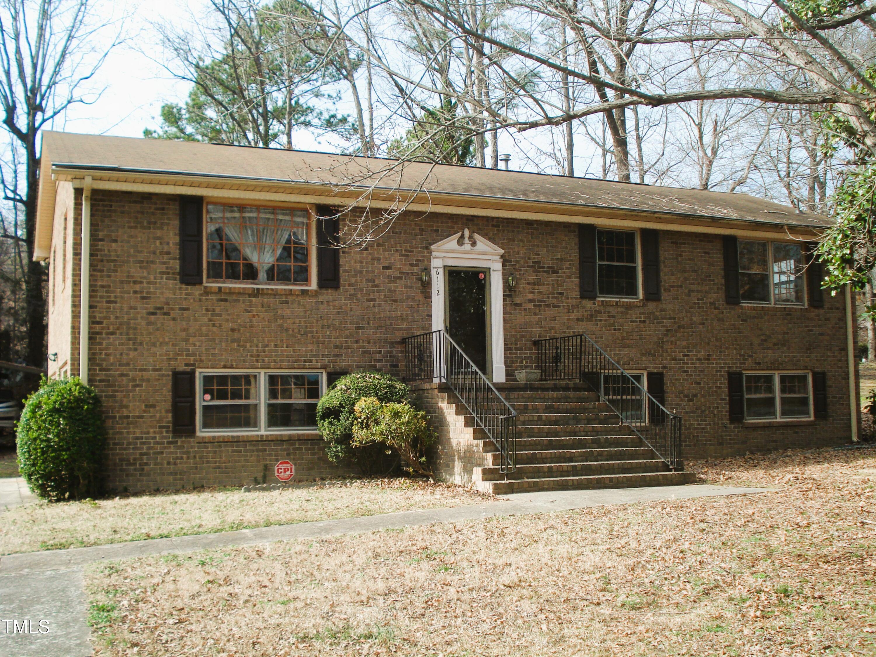 6112 Yellowstone Drive Durham, NC 27713 - Photo 1 of 13 a front view of a house with a yard
