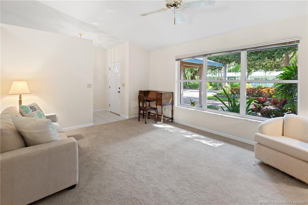 3418 Southeast Jamaica Way Stuart, FL 34997 - Photo 11 of 35 a living room with furniture and a large window