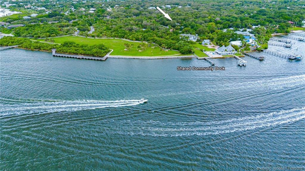 3418 Southeast Jamaica Way Stuart, FL 34997 - Photo 4 of 35 a view of a bench in the garden