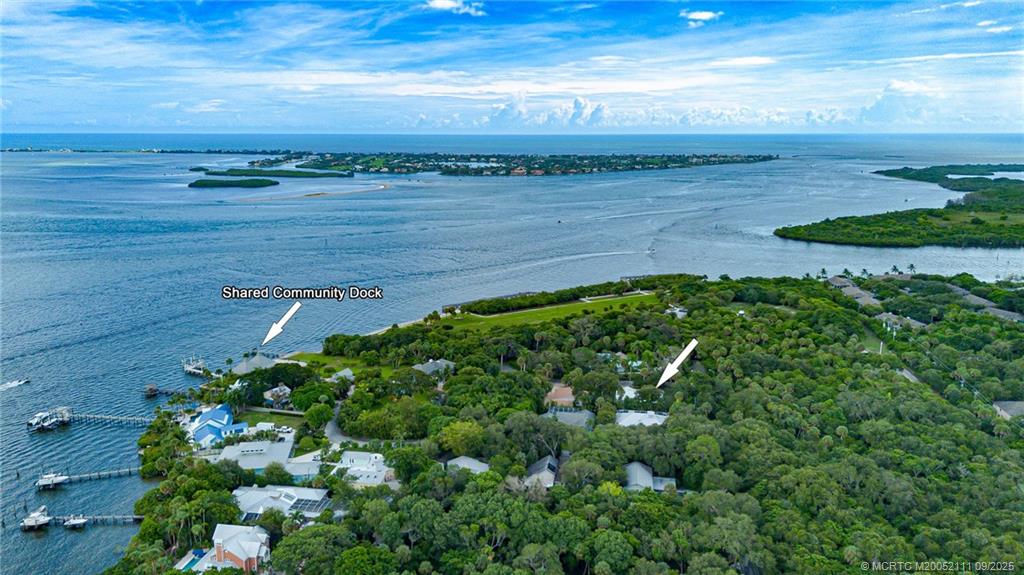 3418 Southeast Jamaica Way Stuart, FL 34997 - Photo 6 of 35 a view of a pathway both side of grassy field with shrub