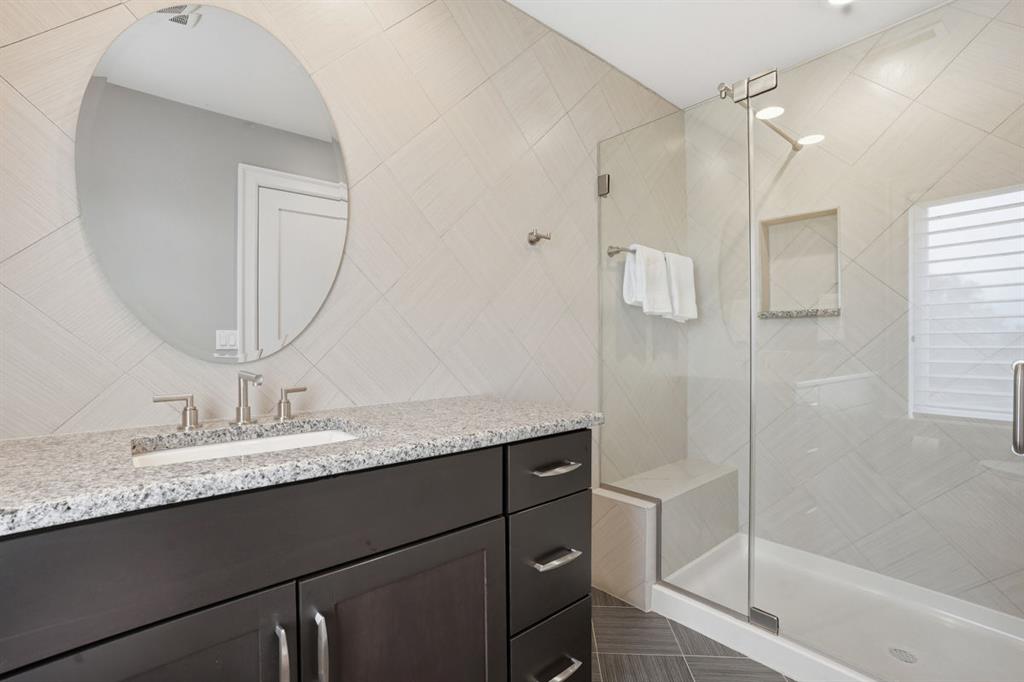 931 Pleasant Hill Road Wexford, PA 15090 - Photo 33 of 50 a bathroom with a granite countertop sink a mirror and shower