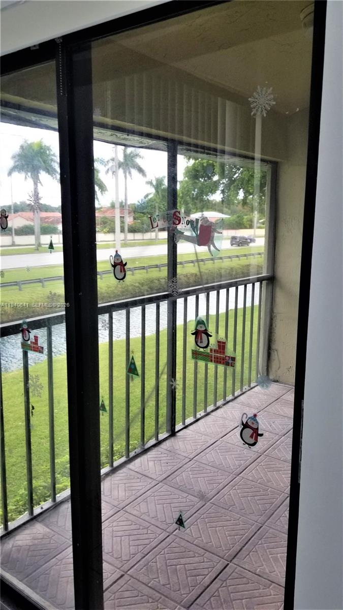 9723 Southwest 138th Avenue, Unit IA2L Miami, FL 33186 - Photo 20 of 27 a view of a porch