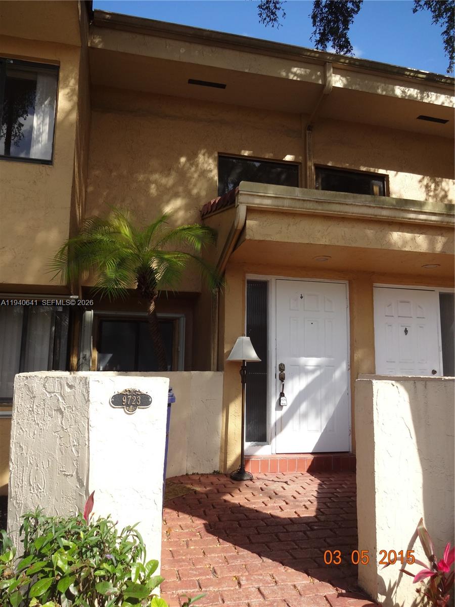 9723 Southwest 138th Avenue, Unit IA2L Miami, FL 33186 - Photo 2 of 27 a kitchen with a refrigerator and a stove