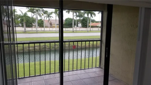 a view of balcony and yard