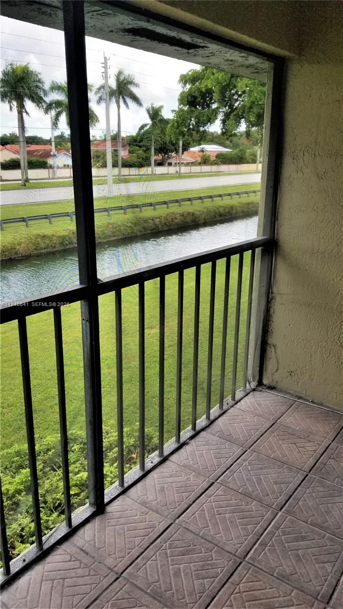 9723 Southwest 138th Avenue, Unit IA2L Miami, FL 33186 - Photo 22 of 27 a view of balcony and yard