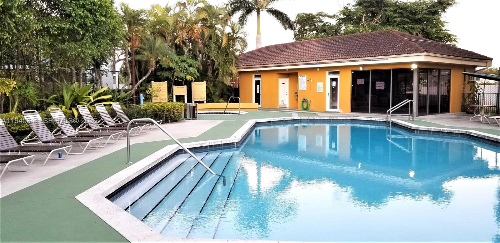 9723 Southwest 138th Avenue, Unit IA2L Miami, FL 33186 - Photo 23 of 27 a view of a house with pool and sitting area